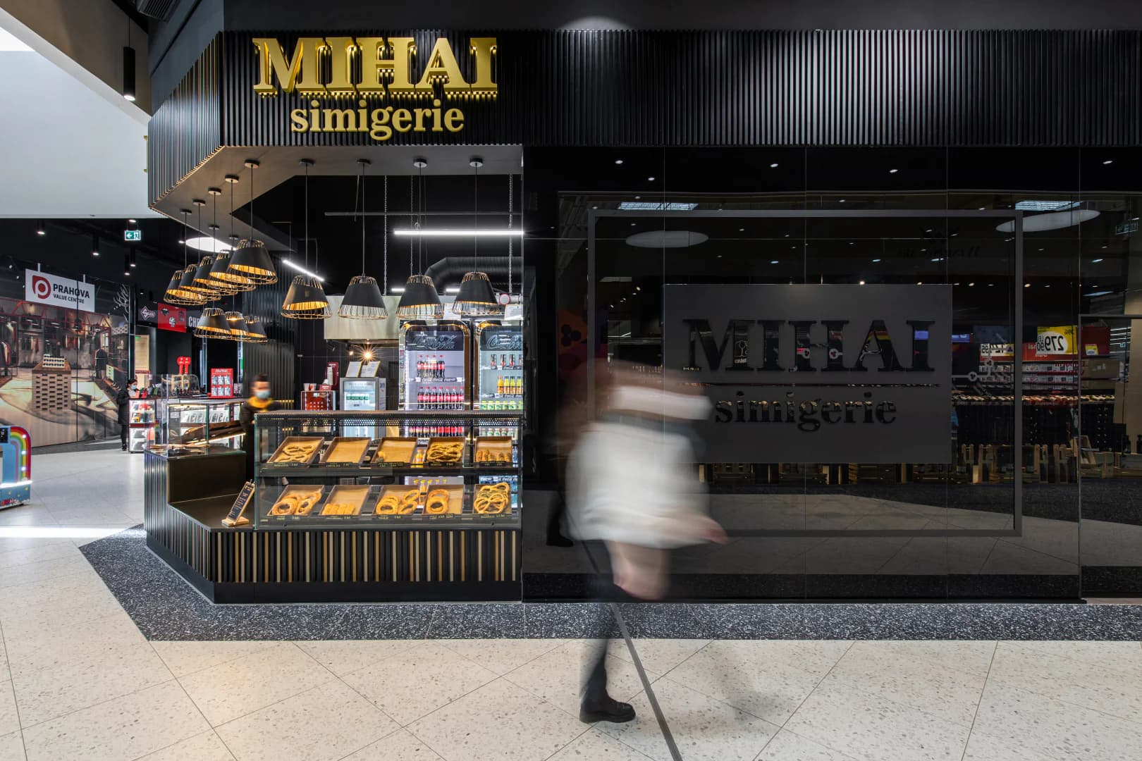 Glass facade of Mihai bakery in Value Center shopping mall