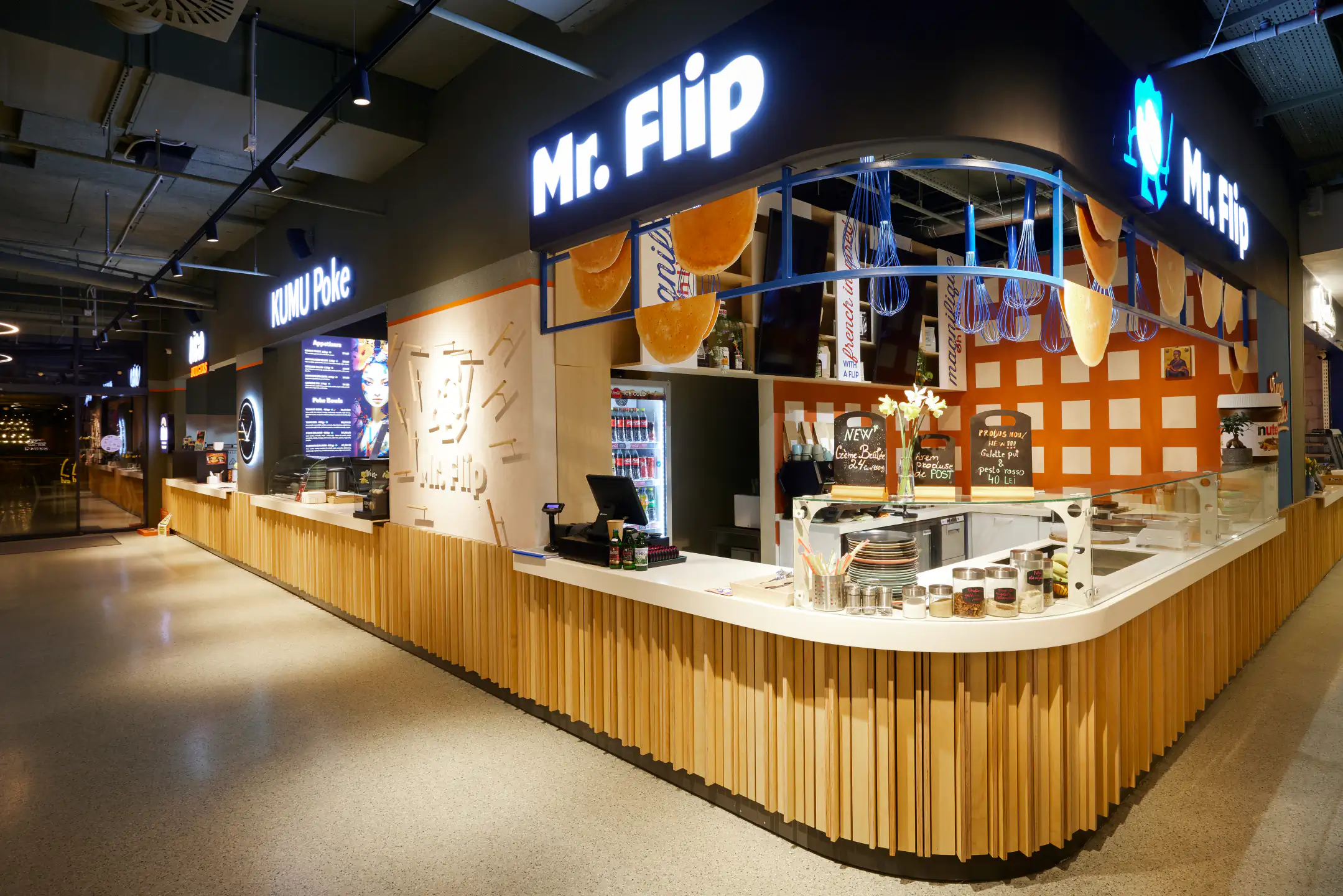 Mr. Flip crêpe stand with vertical wooden slat counter and orange chalkboard-menu wall